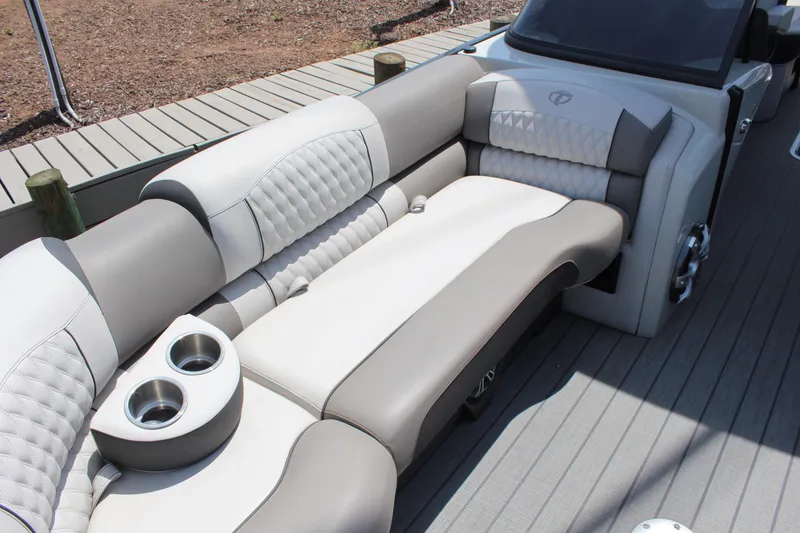 Slide: The Image of Luxurious seating on 2023 Tahoe Pontoon Grand Tahoe 25' boat with cup holders. - 11