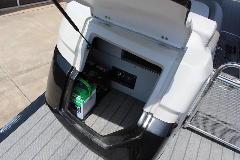 Slide: The Image of 2023 Tahoe Pontoon Grand Tahoe 25' storage compartment with battery and equipment. - 14
