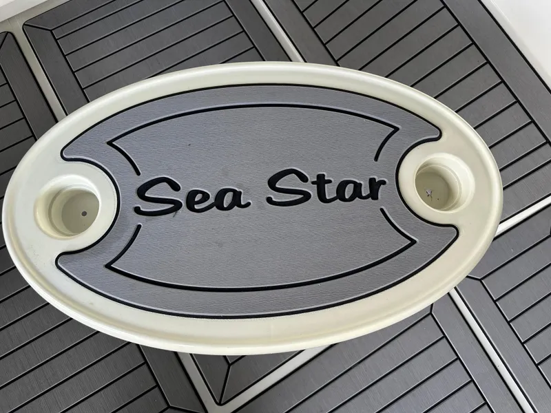 Slide: The Image of Oval boat table with "Sea Star" text, Carver 370 Voyager 1994 model. - 10