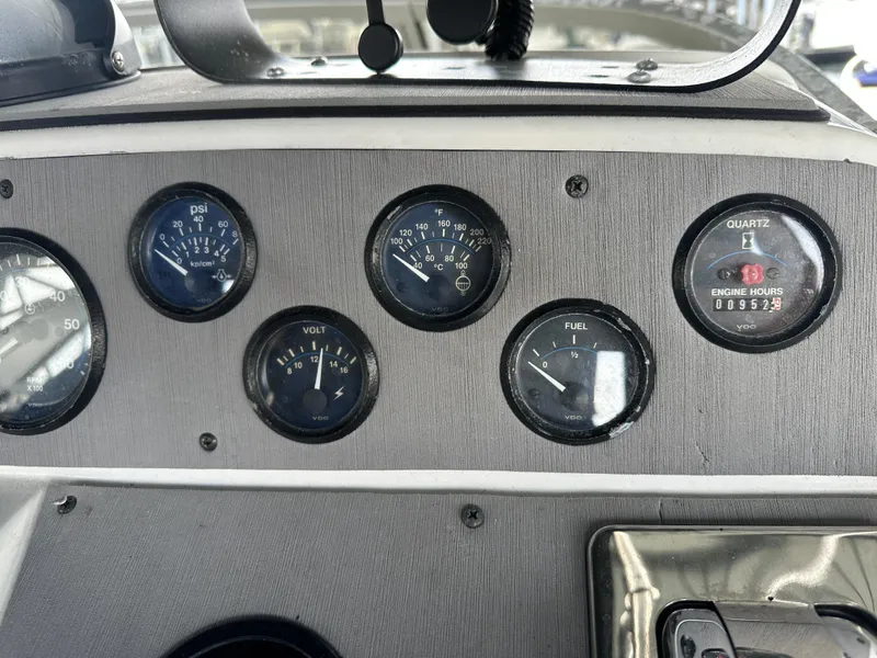 Slide: The Image of Dashboard of a 1994 Carver 370 Voyager boat with gauges and controls. - 19