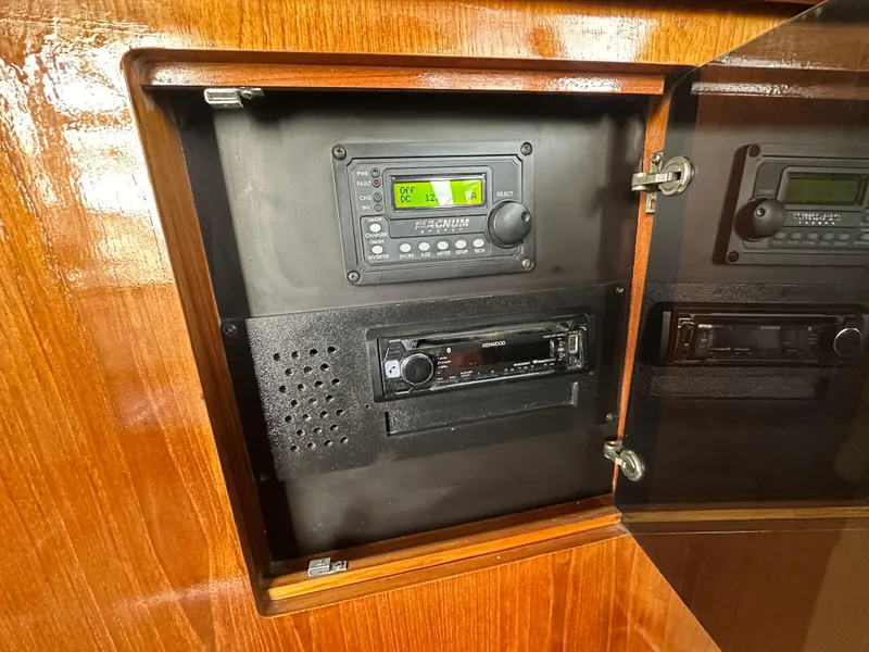 Slide: The Image of 1994 Carver 370 Voyager audio system in wooden cabinet, featuring modern stereo equipment. - 26