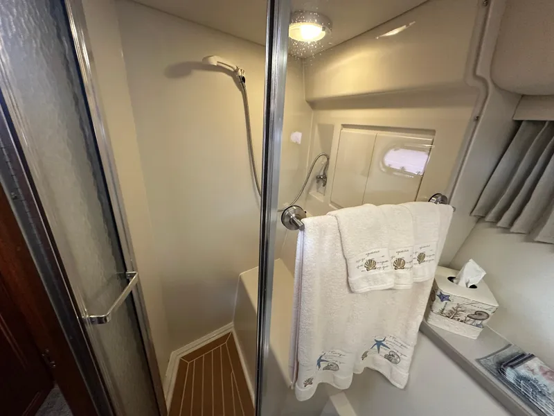 Slide: The Image of Bathroom interior of 1994 Carver 370 Voyager yacht with shower and towel rack. - 40