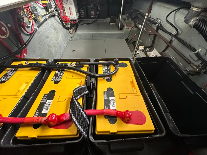 Slide: The Image of Battery compartment of a 1994 Carver 370 Voyager boat with yellow batteries and wiring. - 48