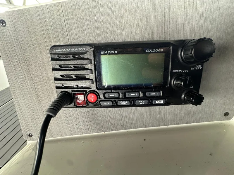 Slide: The Image of Marine radio on a 1994 Carver 370 Voyager boat dashboard. - 15