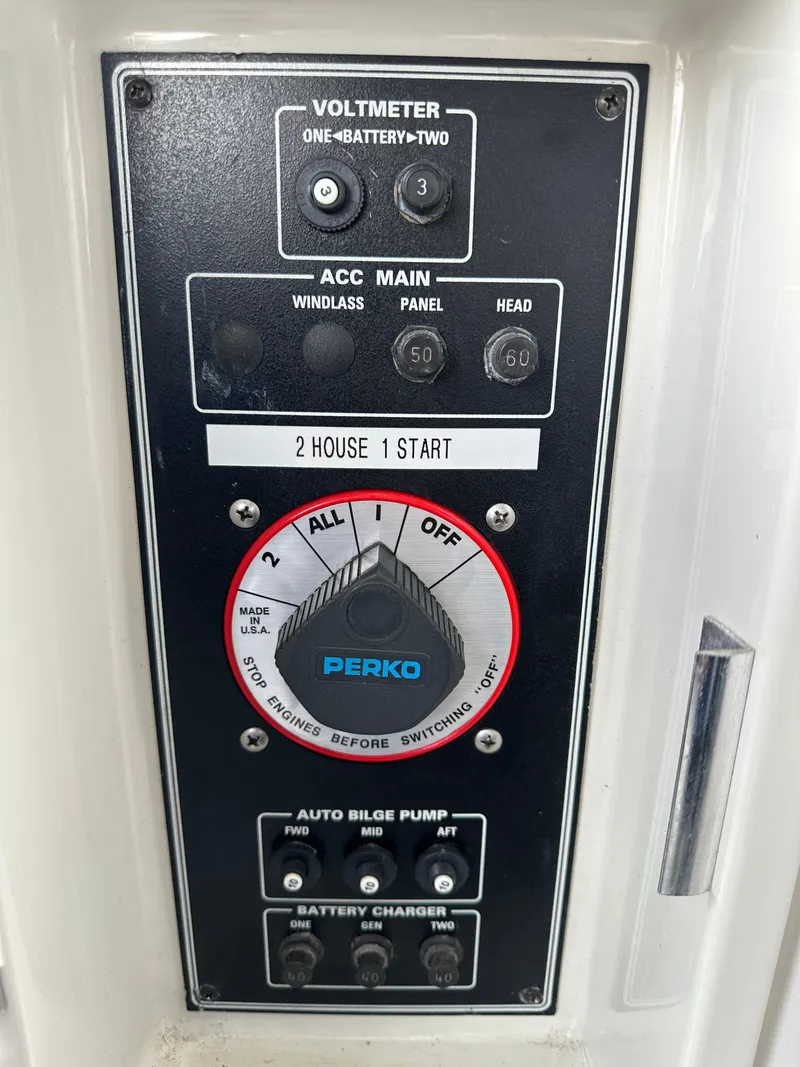 Slide: The Image of Control panel of a 1994 Carver 370 Voyager boat with voltmeter and battery settings. - 21