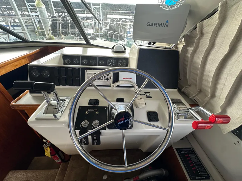 Slide: The Image of 1994 Carver 370 Voyager helm with Garmin navigation and control panel. - 33
