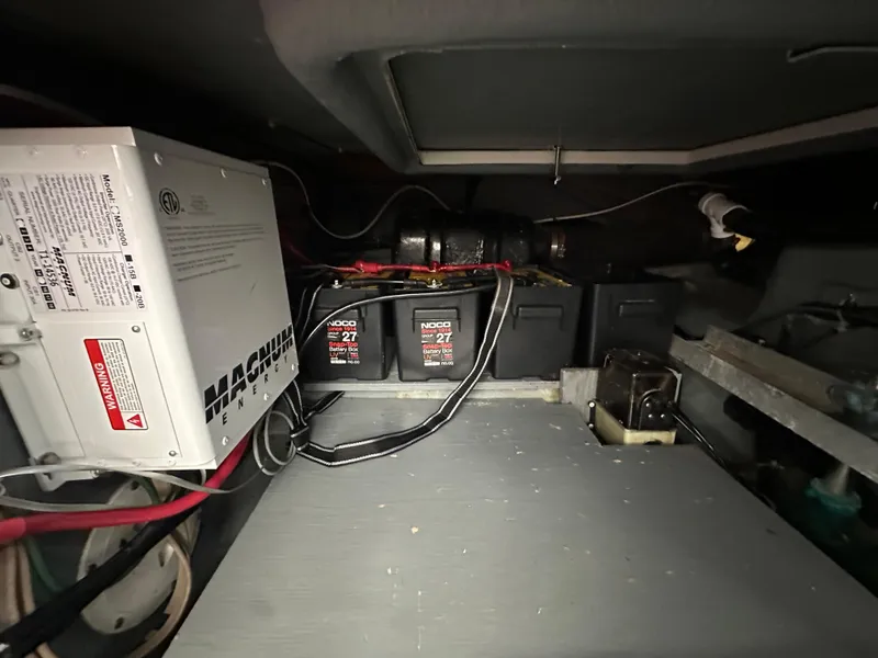 Slide: The Image of Electrical system of a 1994 Carver 370 Voyager, featuring batteries and a Magnum inverter. - 49