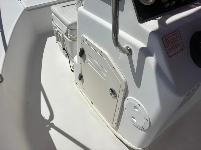 Slide: The Image of 2004 Boston Whaler 170 Montauk boat interior with seating and storage compartment. - 12