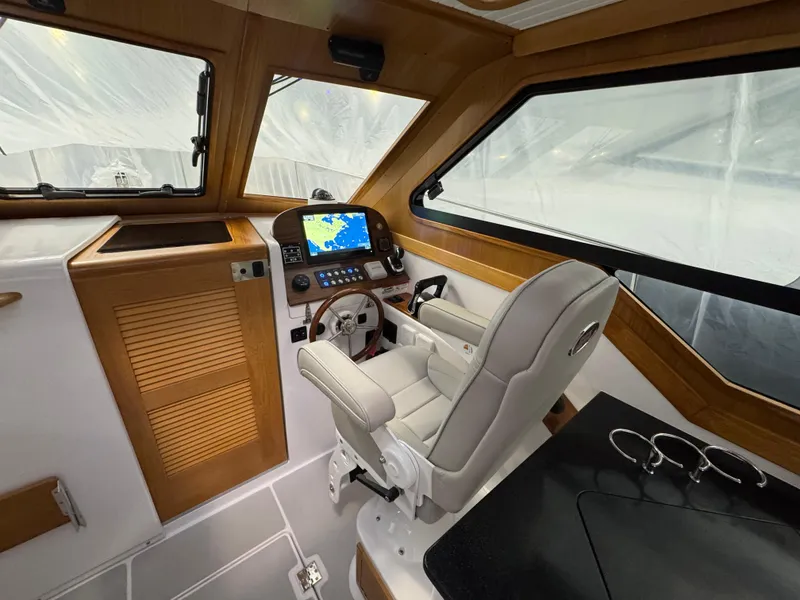 Slide: The Image of Interior of 2022 True North 34 Outboard Express boat with modern helm and navigation system. - 10