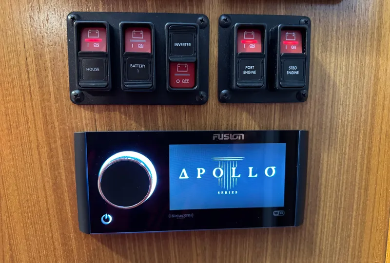 Slide: The Image of Control panel on 2022 True North 34 Outboard Express with Fusion Apollo audio system. - 15