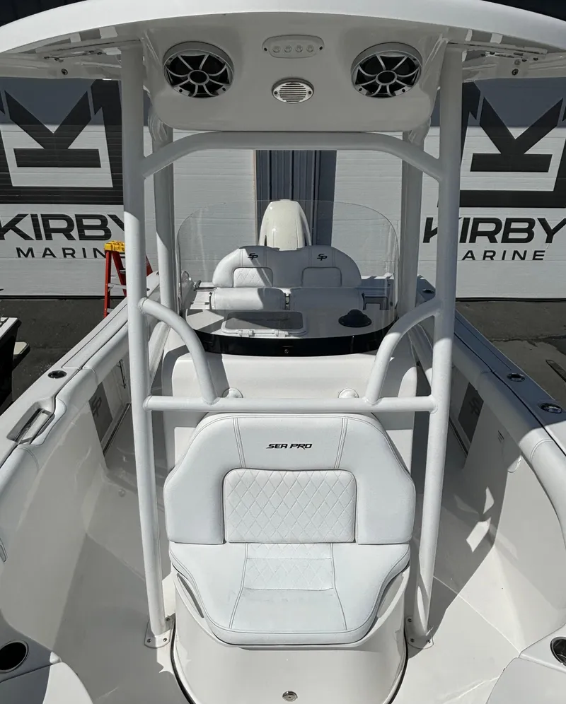 Slide: The Image of 2021 Sea Pro 219 Center Console boat with white seating and Kirby Marine branding. - 10