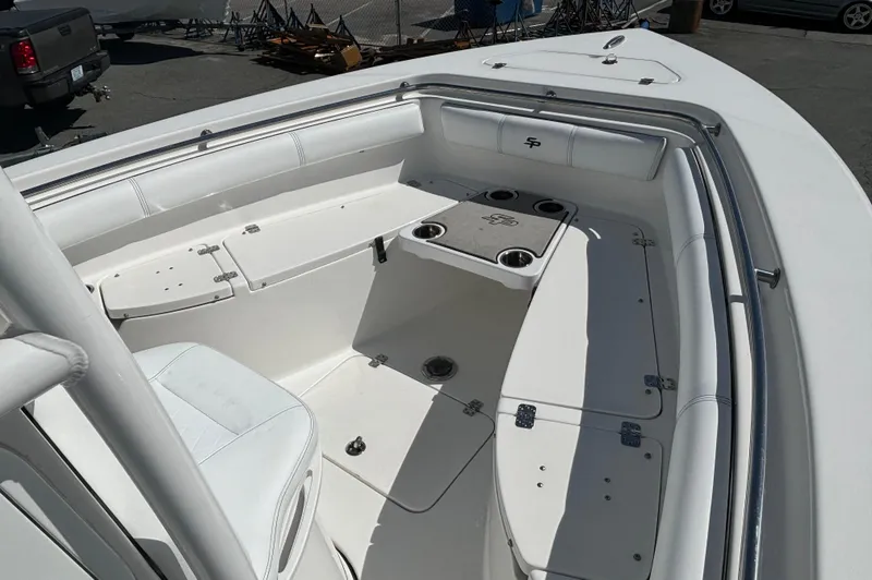 Slide: The Image of 2021 Sea Pro 219 Center Console boat interior with seating and storage compartments. - 4