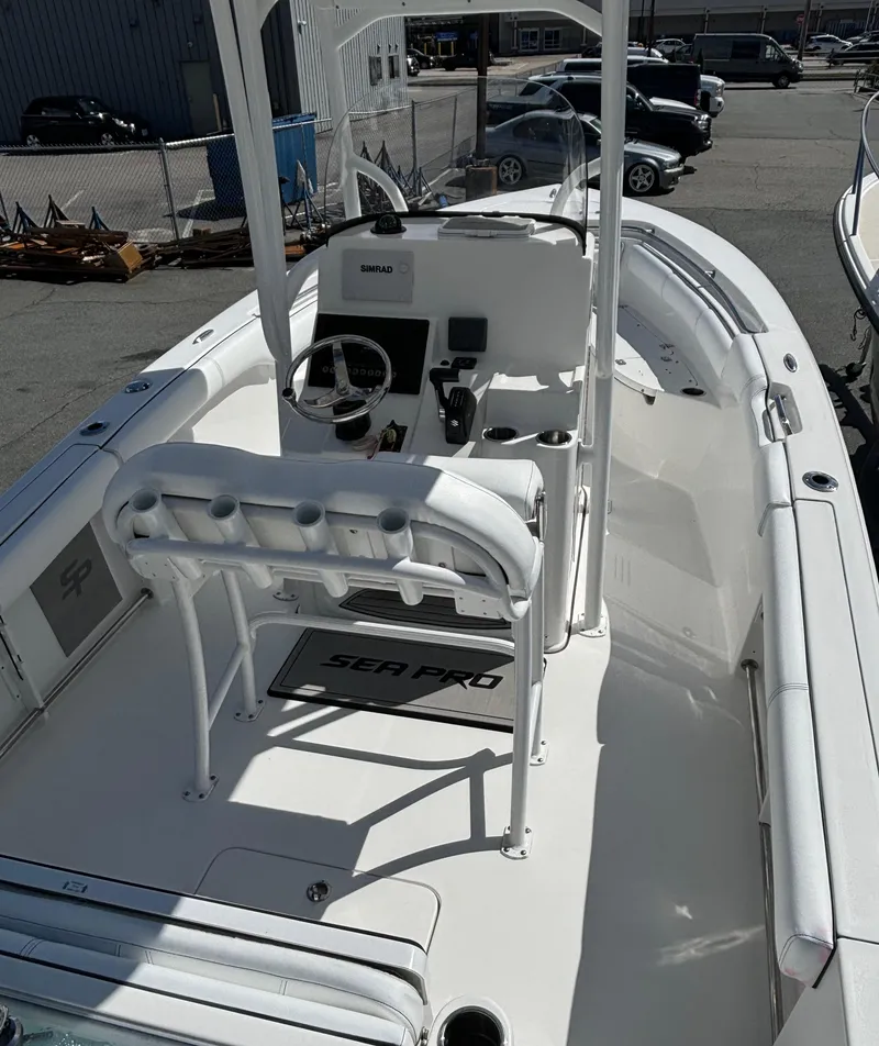 Slide: The Image of 2021 Sea Pro 219 Center Console boat with white interior and modern dashboard. - 9