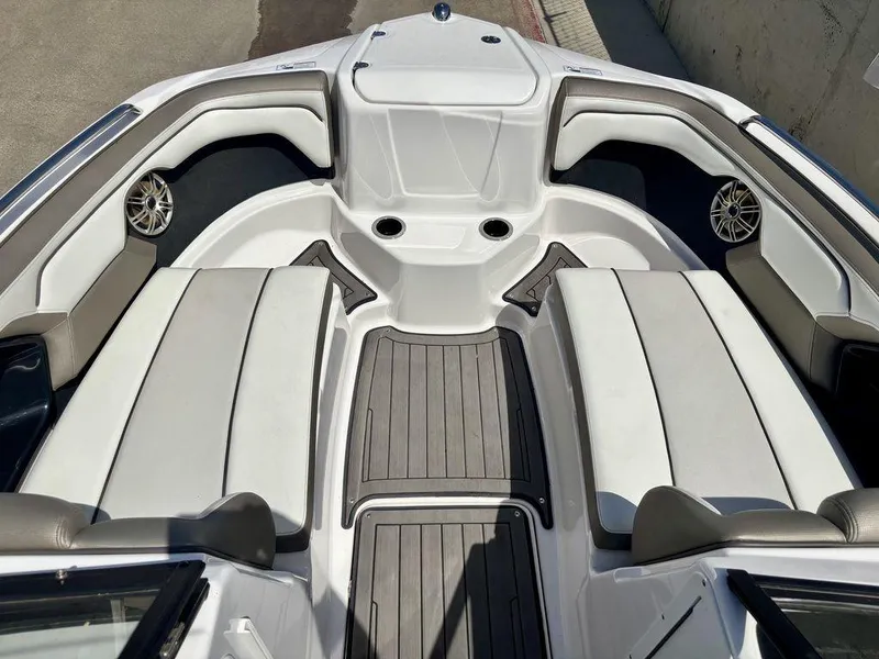 Slide: The Image of 2017 Yamaha Boats 212 Limited S interior with cushioned seating and sleek design. - 4