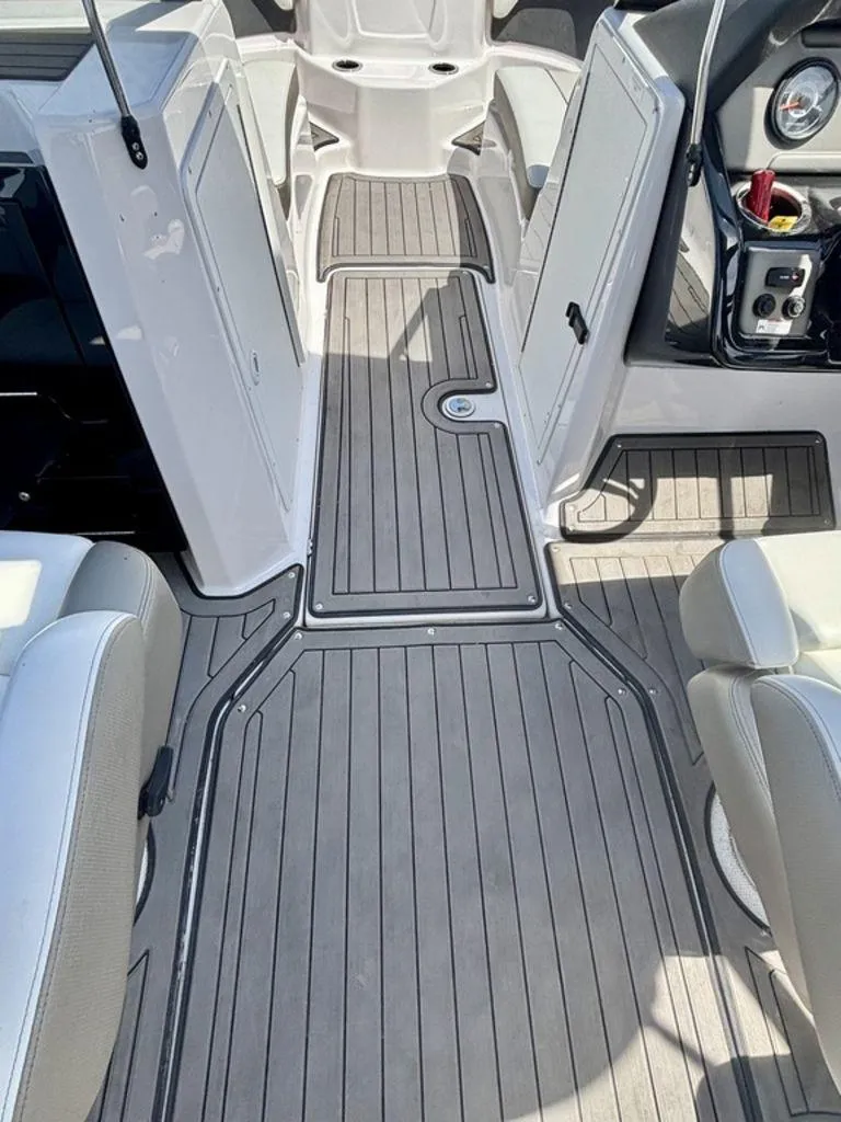 Slide: The Image of 2017 Yamaha Boats 212 Limited S interior with sleek, modern deck design. - 7