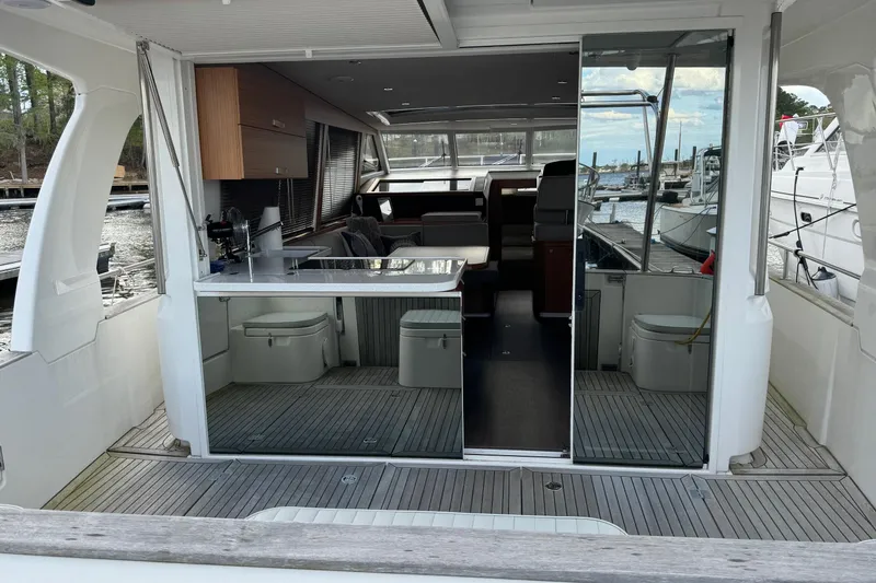 Slide: The Image of 2022 Greenline 40 Hybrid yacht interior with modern kitchen and seating area. - 1