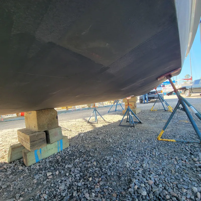 Slide: The Image of Underneath view of a 2022 Greenline 40 Hybrid boat on supports. - 17