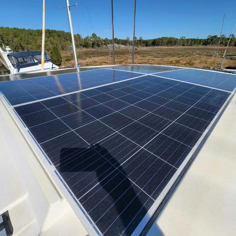 Slide: The Image of Solar panels on 2022 Greenline 40 Hybrid boat under clear blue sky. - 30