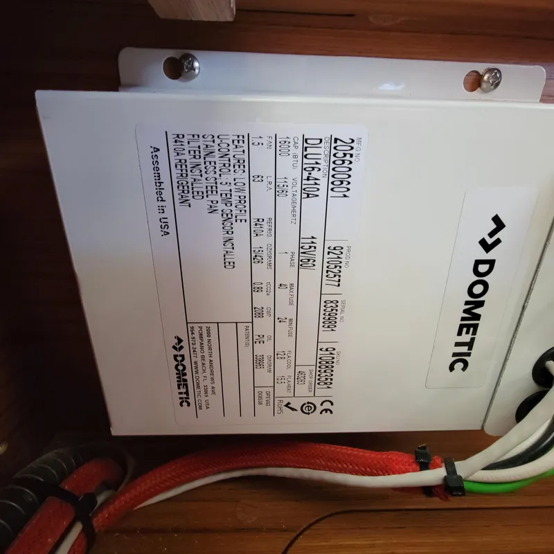 Slide: The Image of Dometic unit label inside 2022 Greenline 40 Hybrid, showing specifications and wiring details. - 35