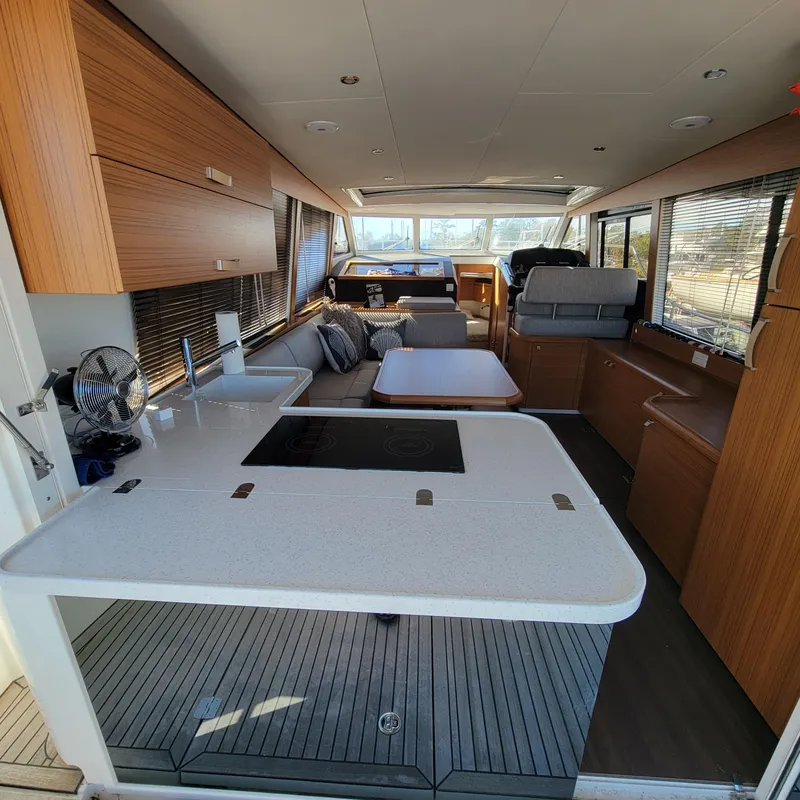 Slide: The Image of Interior of 2022 Greenline 40 Hybrid yacht, featuring modern kitchen and seating area. - 36