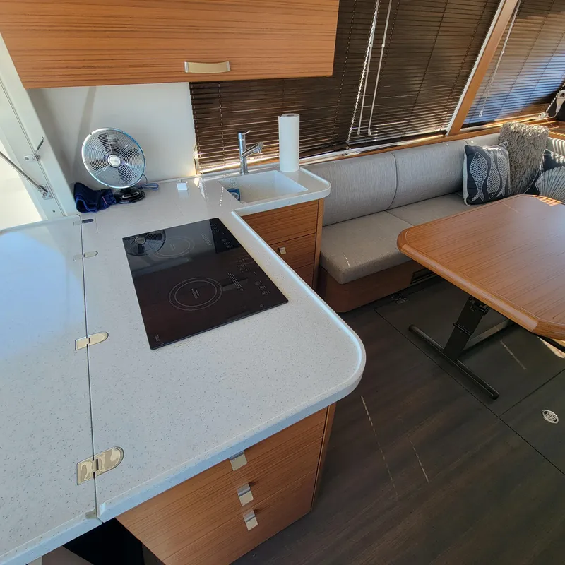Slide: The Image of Interior of 2022 Greenline 40 Hybrid yacht with modern kitchen and dining area. - 37