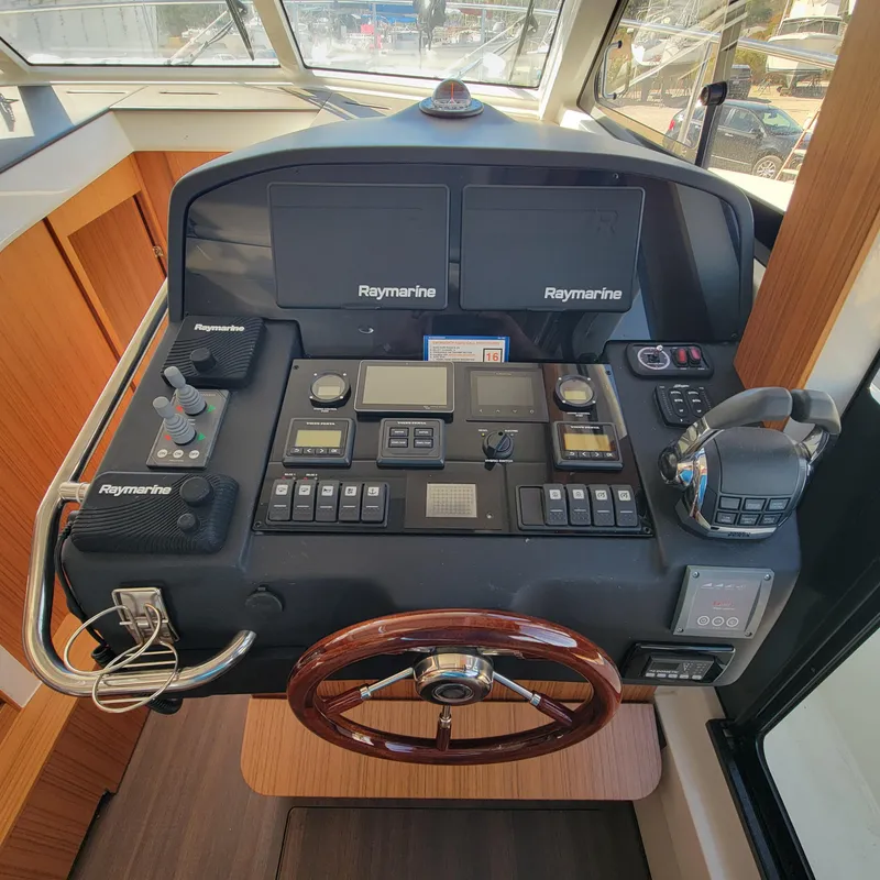 Slide: The Image of Control panel of 2022 Greenline 40 Hybrid yacht with Raymarine navigation systems. - 47