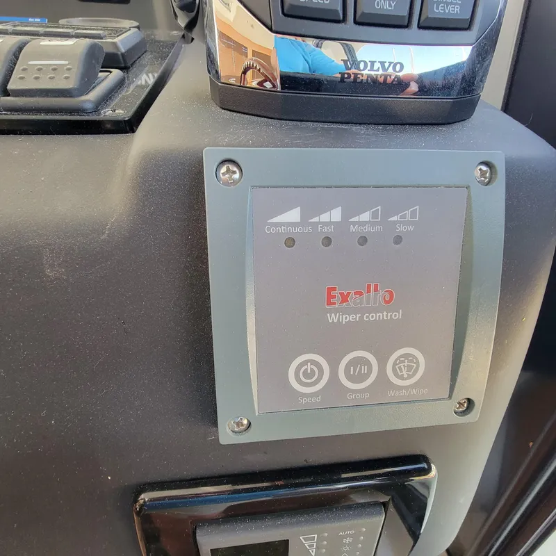 Slide: The Image of Control panel of a 2022 Greenline 40 Hybrid boat with wiper settings. - 49