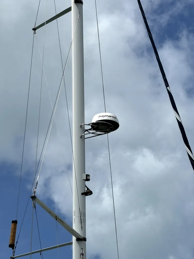 Slide: The Image of Mast of 2005 Hunter 41 Deck Salon sailboat against cloudy sky. - 11