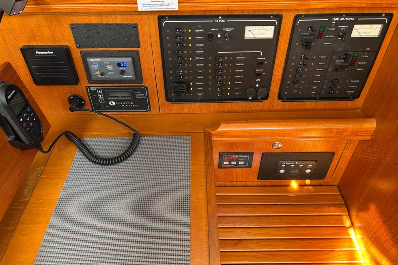 Slide: The Image of Control panel of 2005 Hunter 41 Deck Salon yacht with navigation and communication equipment. - 12