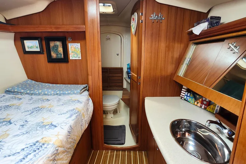 Slide: The Image of Interior of 2005 Hunter 41 Deck Salon yacht with bed, sink, and bathroom. - 23