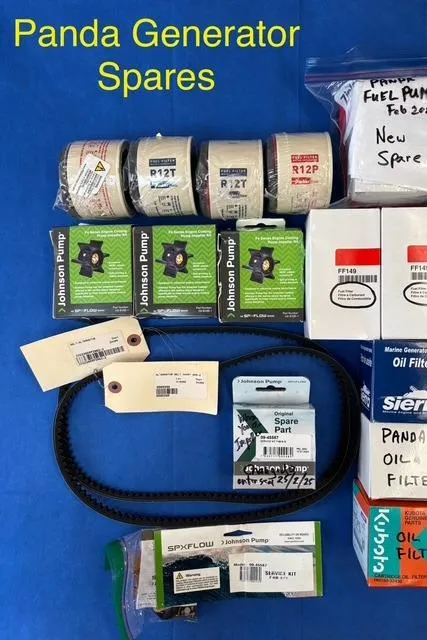 Slide: The Image of Panda generator spares, including filters and belts, for Hunter 41 Deck Salon 2005 model. - 33