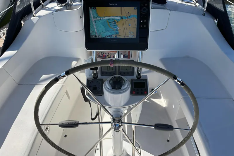 Slide: The Image of Steering wheel and navigation system on 2005 Hunter 41 Deck Salon yacht. - 7