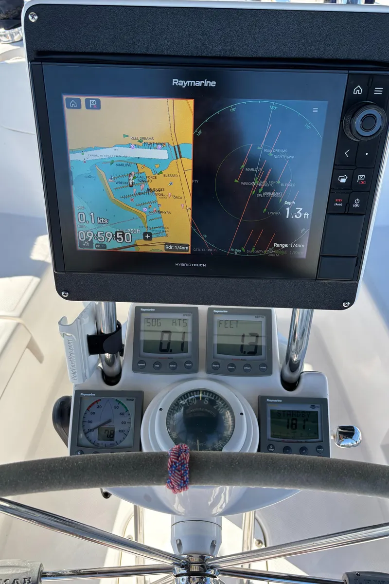 Slide: The Image of Navigation system on 2005 Hunter 41 Deck Salon sailboat, featuring Raymarine display and instruments. - 9
