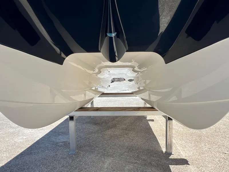 Slide: The Image of 2024 World Cat 260 CC-X catamaran hull on display stand. - 11