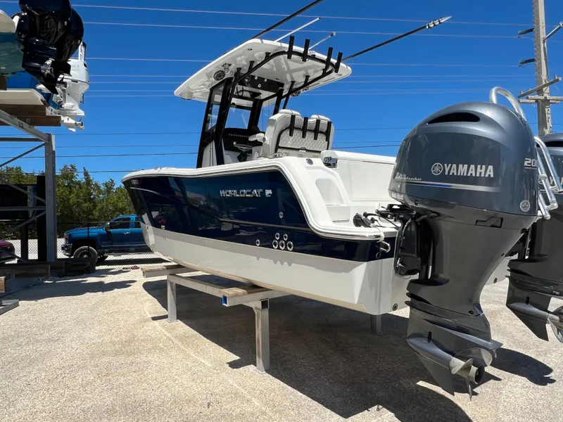 Slide: The Image of 2024 World Cat 260 CC-X boat with Yamaha outboard motor, displayed outdoors. - 13