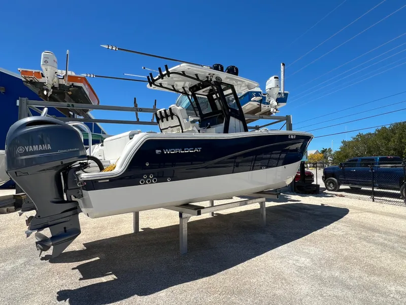 Slide: The Image of 2024 World Cat 260 CC-X boat with Yamaha engine on display outdoors. - 14