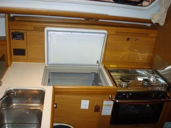 Slide: The Image of Interior of 2010 Jeanneau Sun Odyssey 36i yacht kitchen with stove and sink. - 9