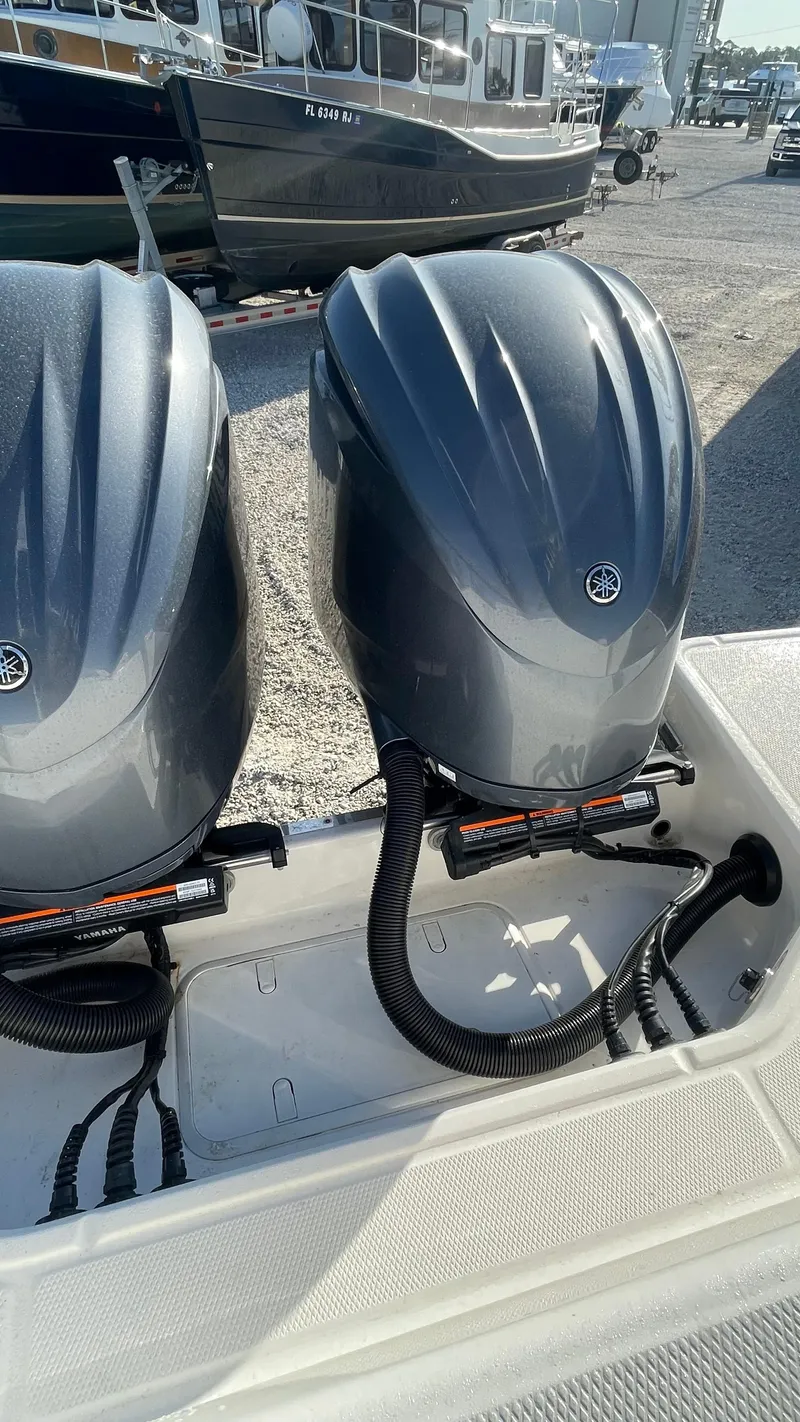 Slide: The Image of 2023 Robalo R272 Center Console with dual Yamaha outboard engines. - 10