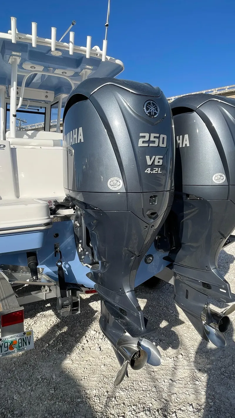 Slide: The Image of 2023 Robalo R272 Center Console with twin Yamaha 250 V6 outboard engines. - 18