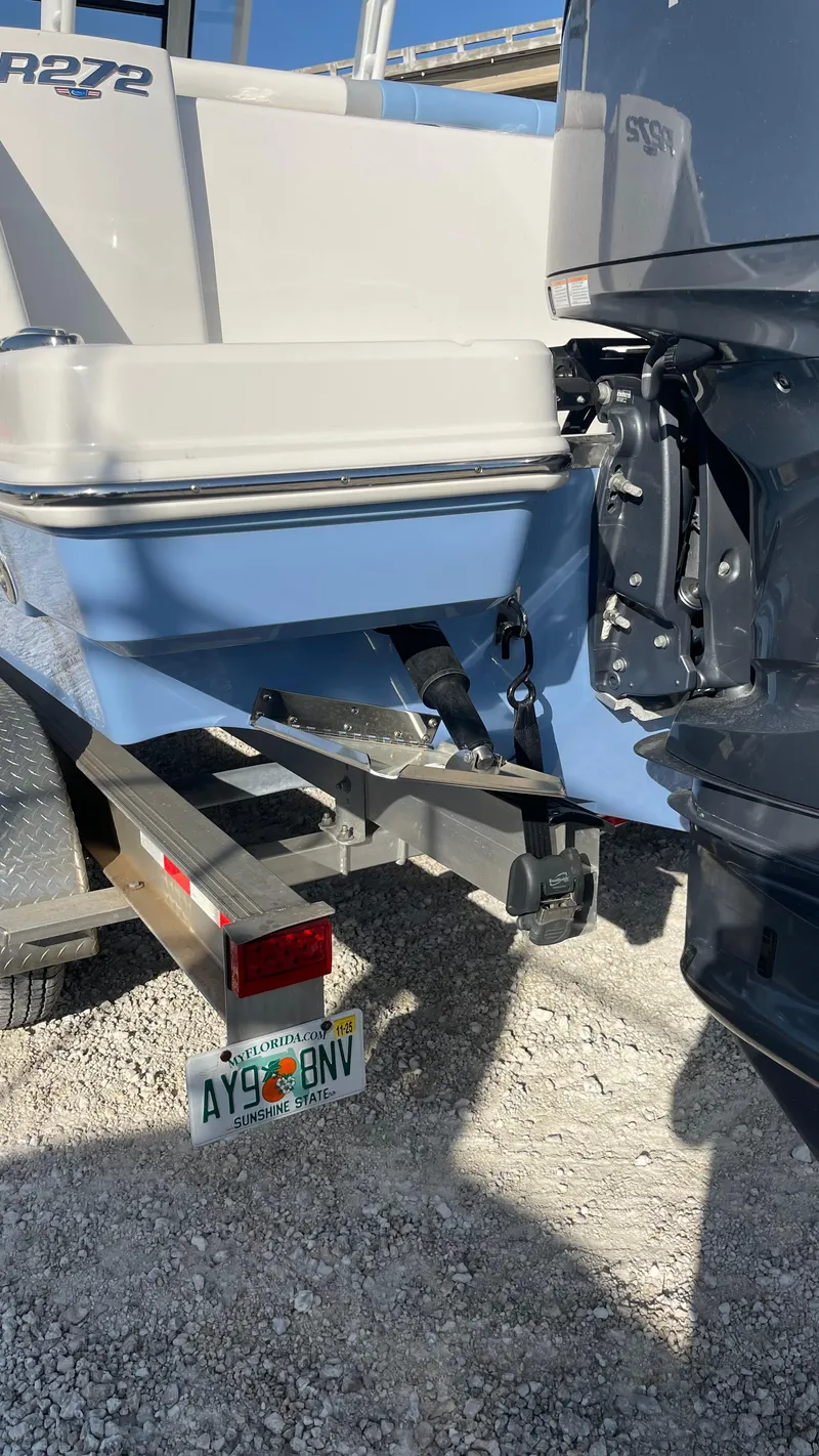 Slide: The Image of 2023 Robalo R272 Center Console boat on trailer, rear view, sunny day. - 20