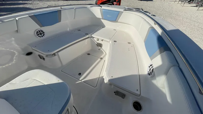 Slide: The Image of 2023 Robalo R272 Center Console boat interior with seating and storage compartments. - 29