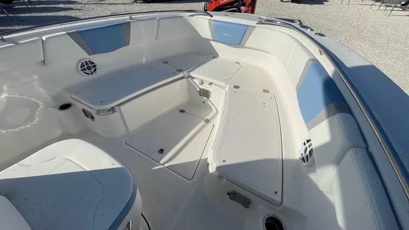 Slide: The Image of 2023 Robalo R272 Center Console boat interior with seating and storage compartments. - 30