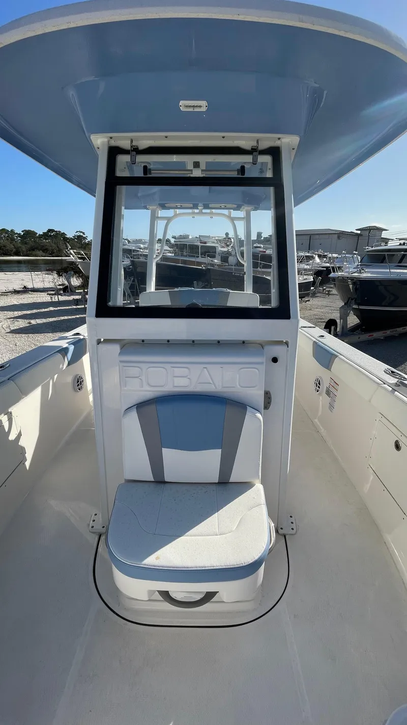 Slide: The Image of 2023 Robalo R272 Center Console boat with seating and console view. - 31