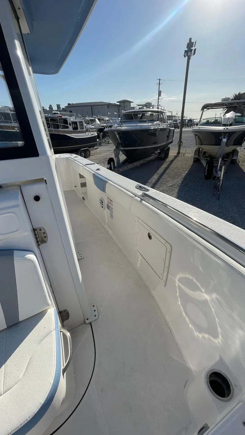 Slide: The Image of 2023 Robalo R272 Center Console boat interior, showcasing sleek design and spacious layout. - 32