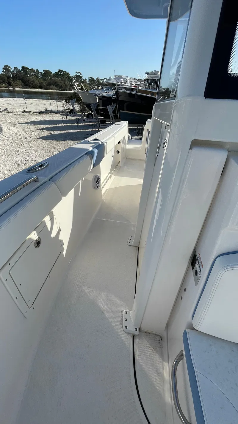 Slide: The Image of 2023 Robalo R272 Center Console boat deck with sleek design and modern features. - 33