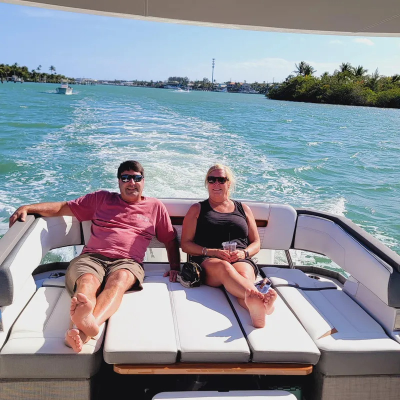 Slide: The Image of Couple relaxing on a 2021 Tiara Yachts 38 LS, cruising on a sunny day. - 15