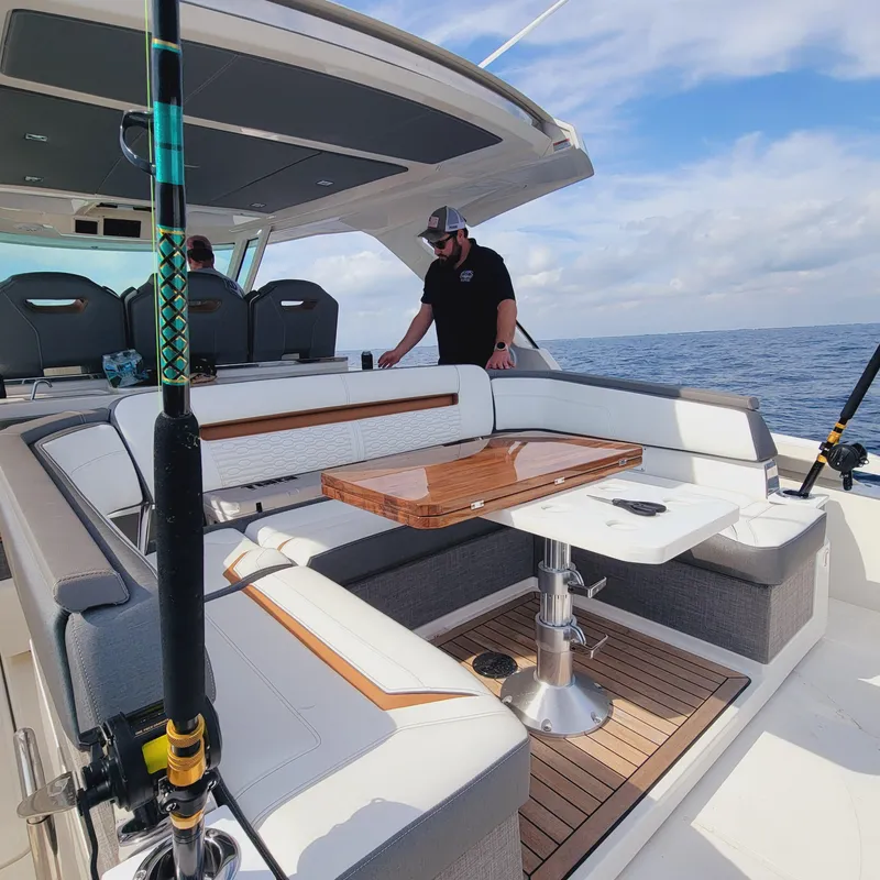 Slide: The Image of 2021 Tiara Yachts 38 LS interior with seating and table, ocean view. - 26