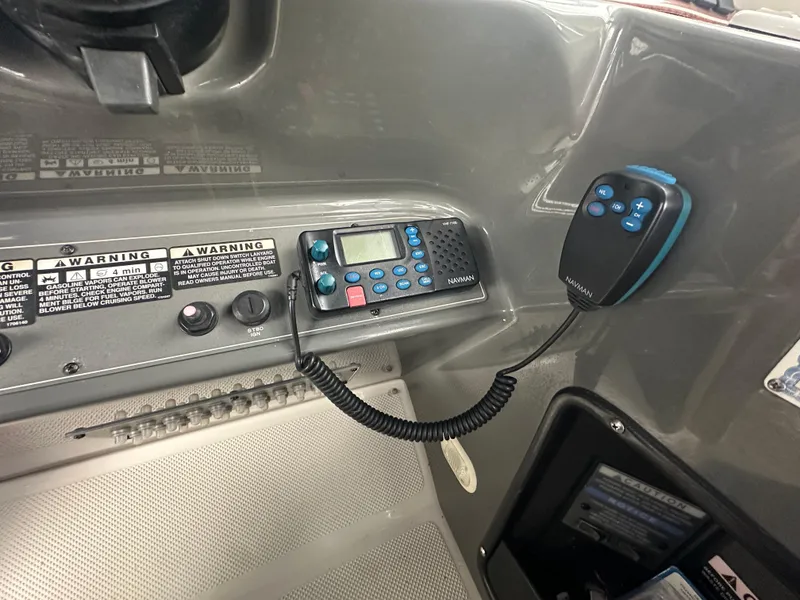 Slide: The Image of Control panel of a 2005 Bayliner 305 boat with communication equipment. - 13