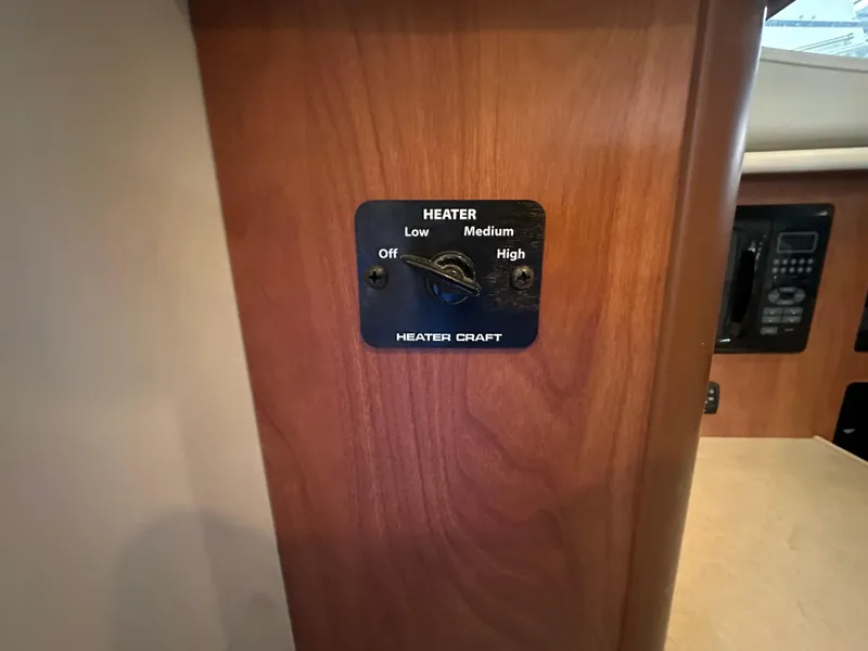 Slide: The Image of Heater control panel on 2005 Bayliner 305 boat interior. - 18