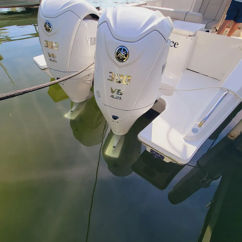 Slide: The Image of 2023 Pursuit OS 325 Offshore with twin Yamaha 300 V6 outboard engines. - 16